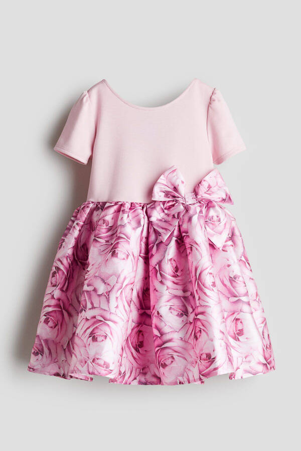 A dress with a short flared skirt. - 1