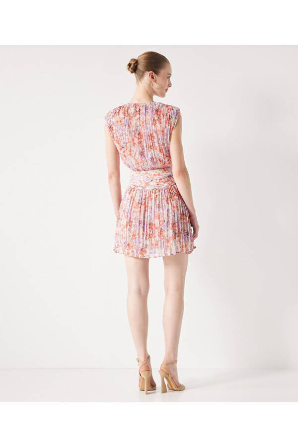 A patterned dress with ruffles. - 6