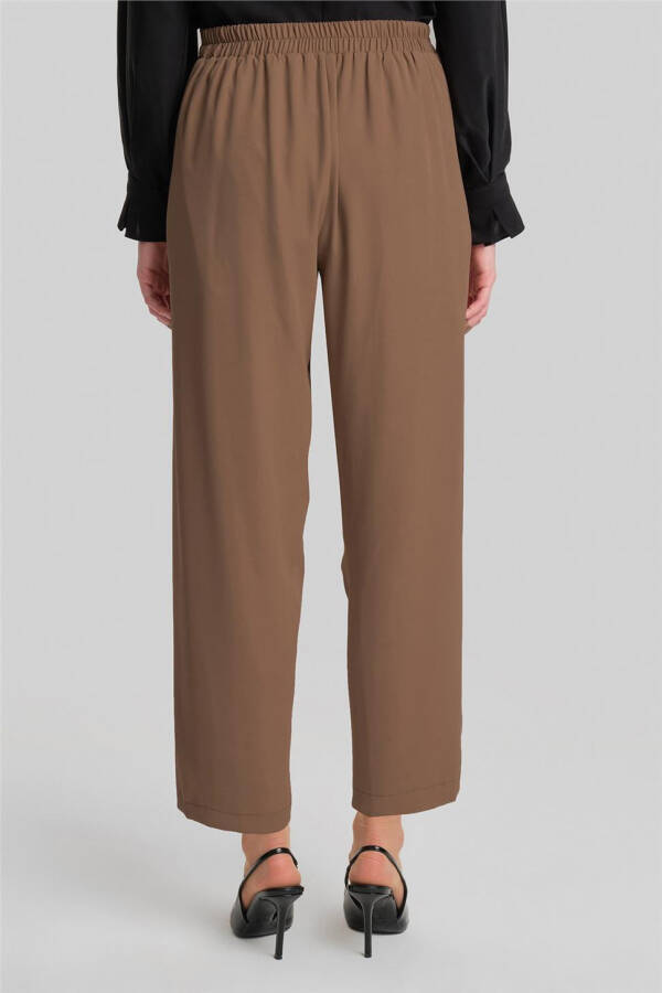 Asymmetrical belted pants, code 24Y2609, almond color. - 5