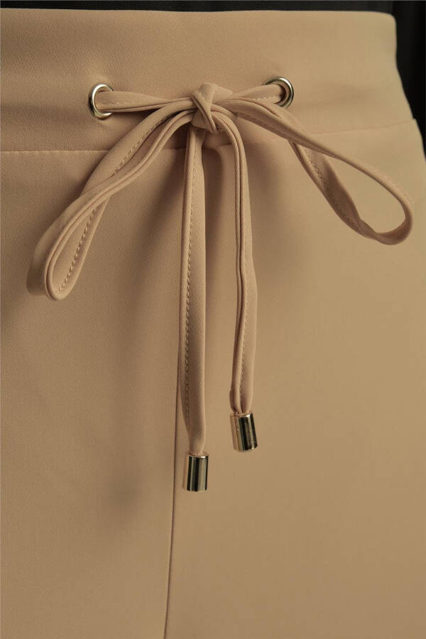 Asymmetrical cuffed pants, 24Y2609, Biscuit color. - 9