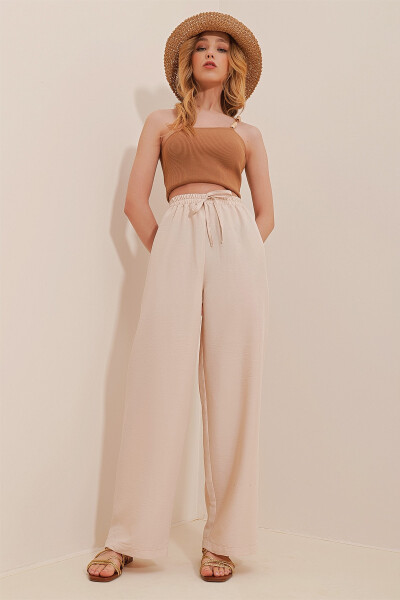 Beige, elastic waist, relaxed fit aerobics pants. ALC-X6625 