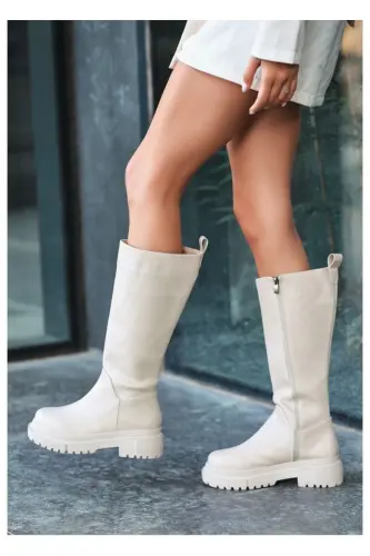 Beige, zippered, knee-high boots. 