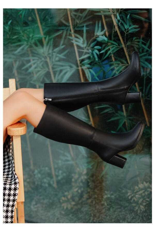 Black leather heeled boots. - 6