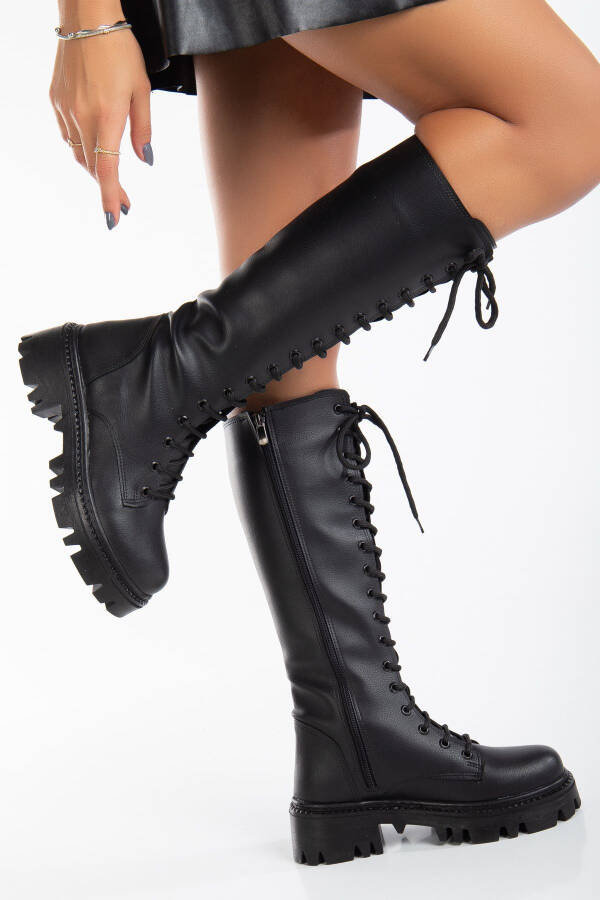 Black matte leather lace-up ankle boots. - 1