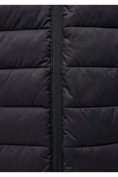 Black puffer jacket, stand-up collar. - 7