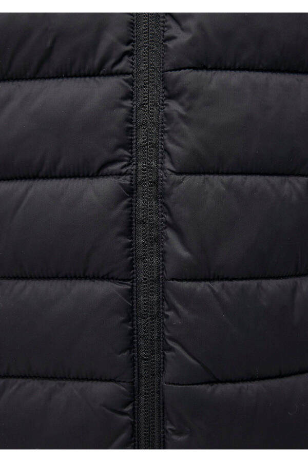 Black puffer jacket, stand-up collar. - 7