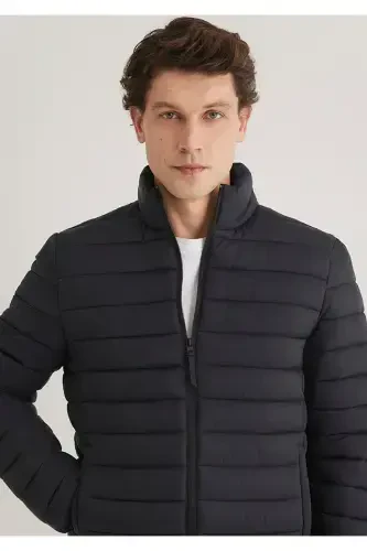 Black puffer jacket, stand-up collar. - 1