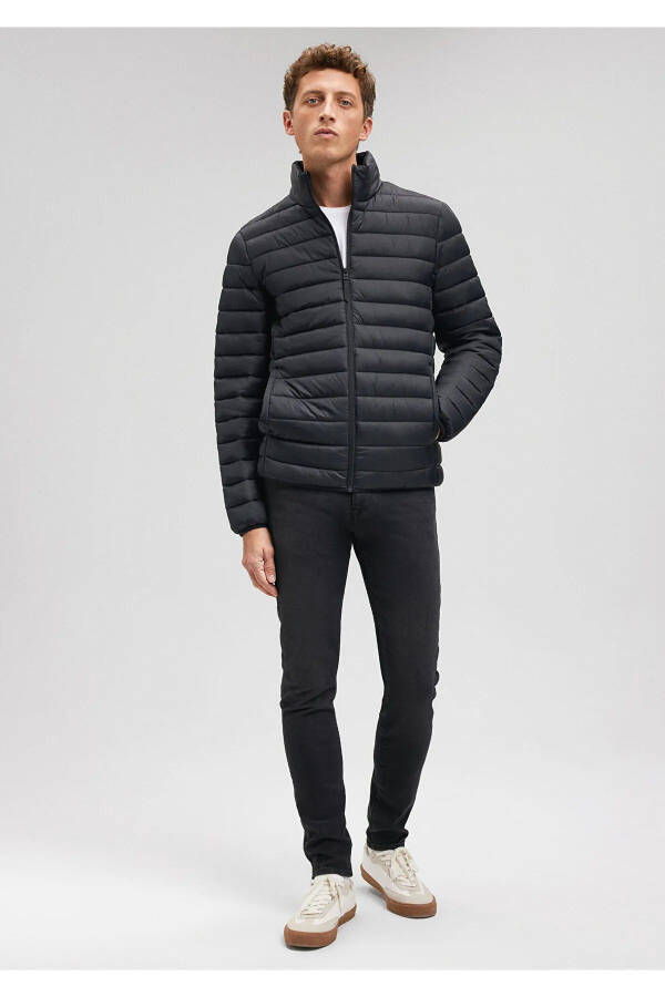 Black puffer jacket, stand-up collar. - 1