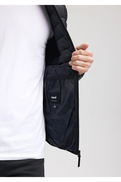 Black puffer jacket, stand-up collar. - 5