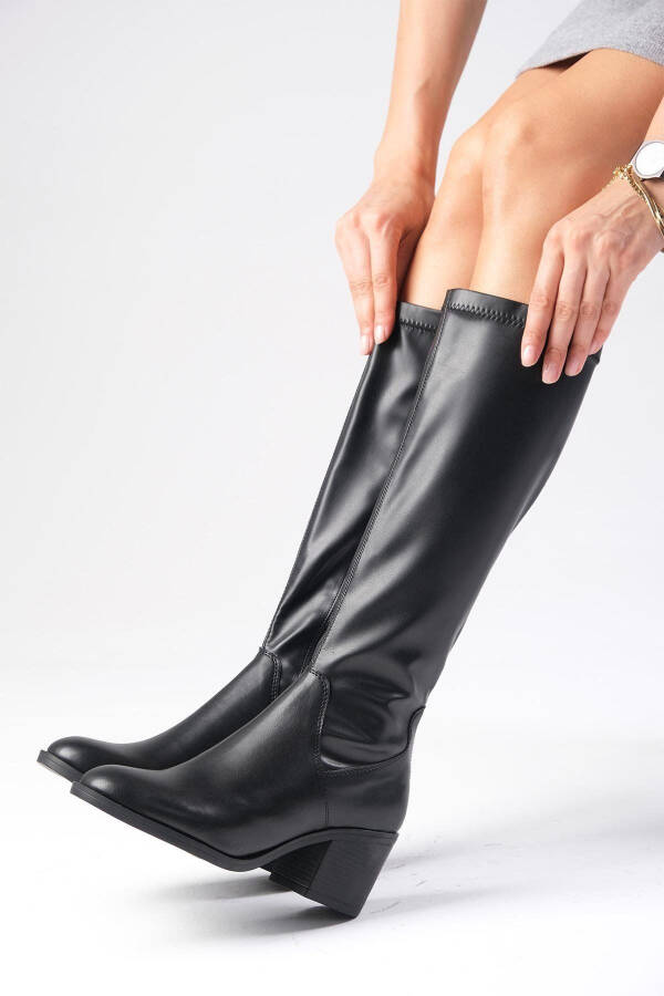 Black stretch, heeled women's boots. - 2