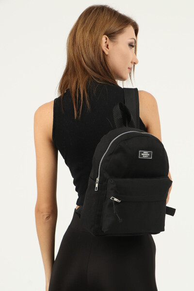 Black unisex backpack with 2 front pockets and zipper, made of canvas fabric. U: 32 cm W: 24 cm D: 11 cm - 3