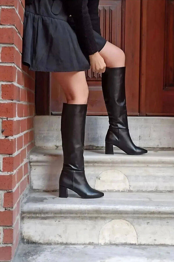 Black zipper knee-high heeled boots. - 8