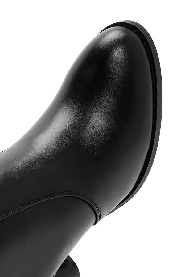 Black zippered, chunky heeled leather boots. - 2