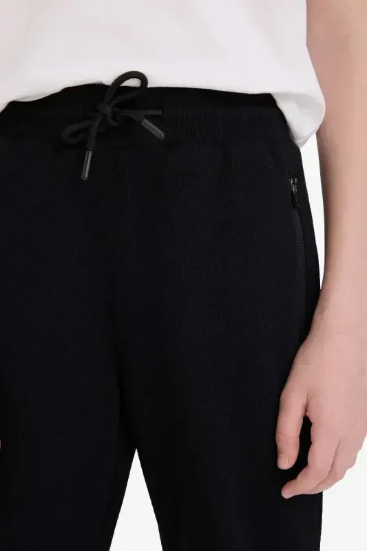 Black zippered fleece sweatpants for boys - DEFACTO