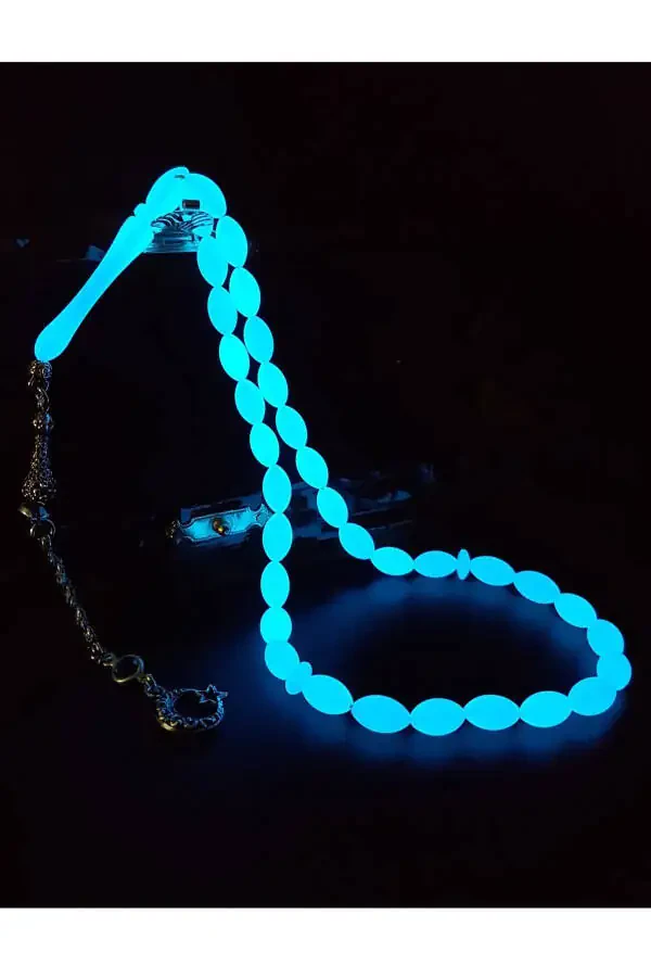 Blue phosphorescent barley cut cat's eye rosary. - 2