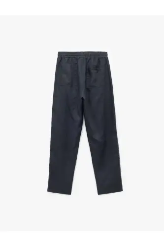 Брюки льняные oversize с карманами и кулиской на талии - 9