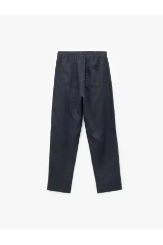Брюки льняные oversize с карманами и кулиской на талии - 4
