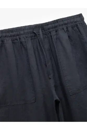 Брюки льняные oversize с карманами и кулиской на талии - 5