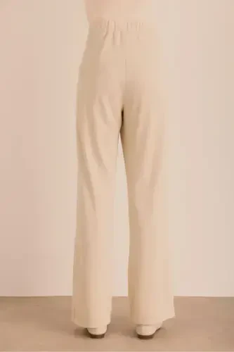 Брюки трикотажные с люрексом на подкладке с эластичной талией - 6