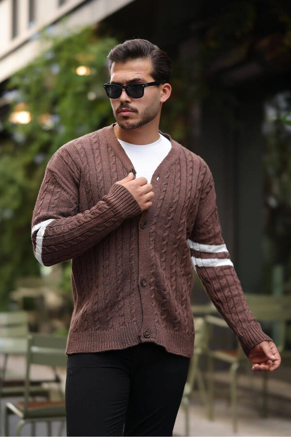 Brown knitted cardigan with braid sleeves and ribbon details. - 2