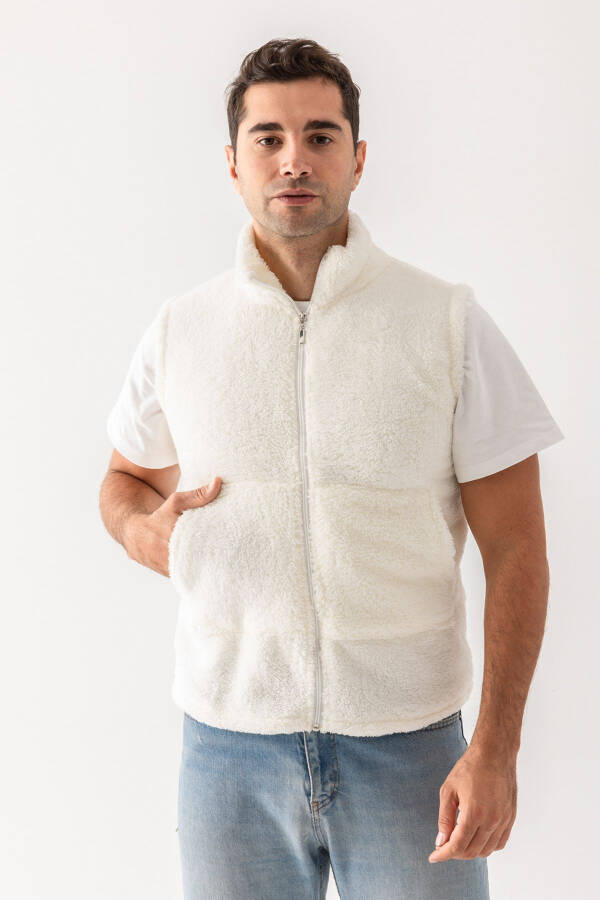 Cream colored, sleeveless, zippered plush vest. - 1