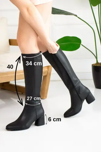 Daily, black, oval toe, high heeled, lug sole, zippered, knee high boot. 