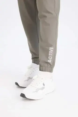 Dokuma Esnek Multifonksiyonel Sporcu Jogger Eşofman Altı Slim Fit Dar Kesim Çift Cepli-Haki - DEFACTO (1)