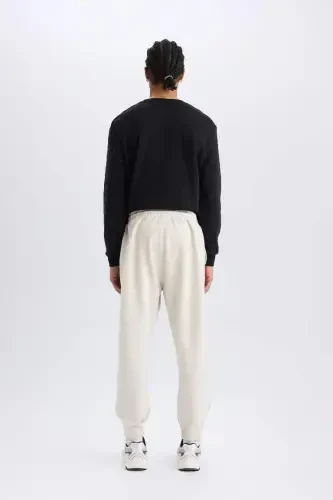 DeFactoFit NBA Milwaukee Bucks Jogger sport shim Standart Fit cho'ntakli elastik bantli shim Skuba sho'ng'in matosi-Tosh - DEFACTO (1)