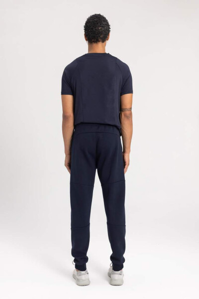 DeFactoFit Sporcu Jogger Eşofman Altı Slim Fit Dar Kesim Çift Cepli Beli Paçası Lastikli Skuba Dalgıç Kumaş Lacivert - 9