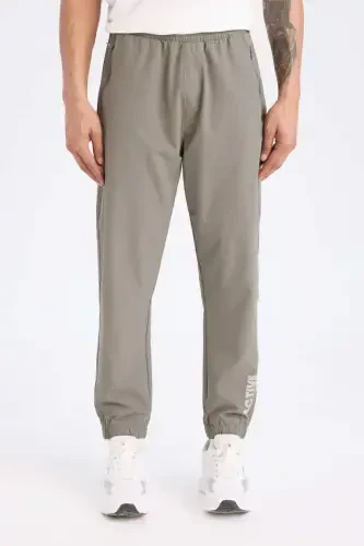 DeFactoFit Woven Flexible Multifunctional Athlete Jogger Sweatpants Slim Fit Narrow Cut Double Pocket-Khaki - 1