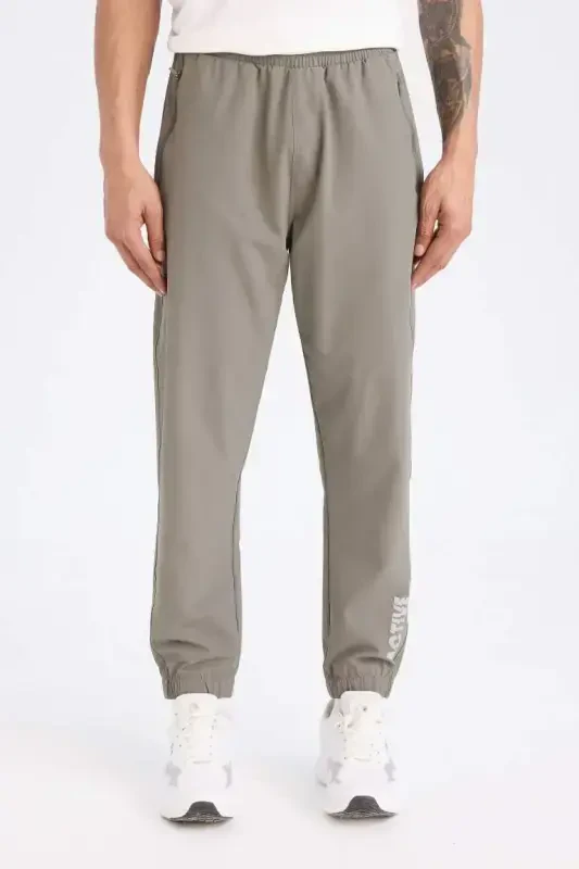 DeFactoFit Woven Flexible Multifunctional Athlete Jogger Sweatpants Slim Fit Narrow Cut Double Pocket-Khaki - DEFACTO