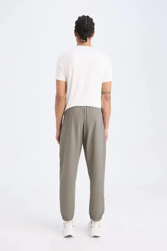 DeFactoFit Woven Flexible Multifunctional Athlete Jogger Sweatpants Slim Fit Narrow Cut Double Pocket-Khaki - 3