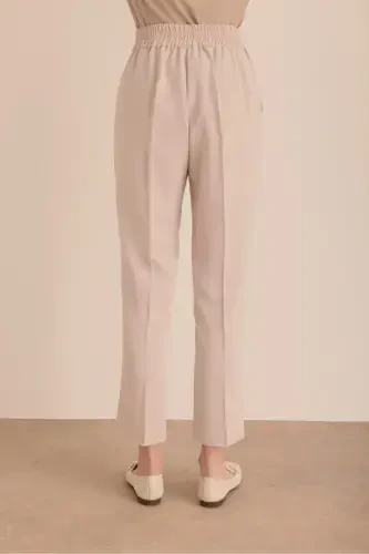 Detailed woven carrot pants with elastic waist. - 6