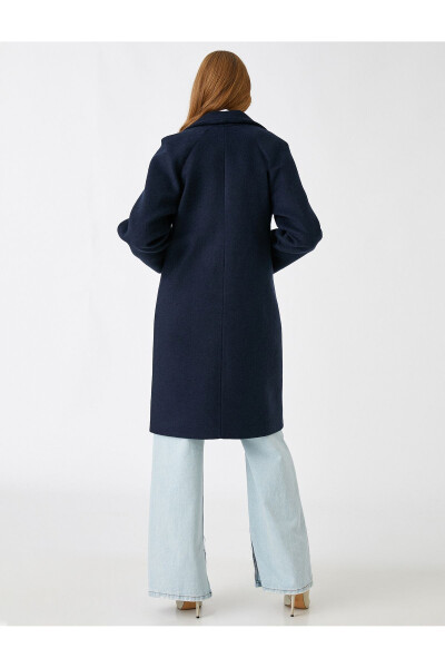 Double-breasted, wool blend coat with pockets. - 9