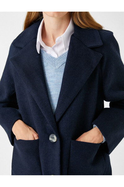 Double-breasted, wool blend coat with pockets. - 10