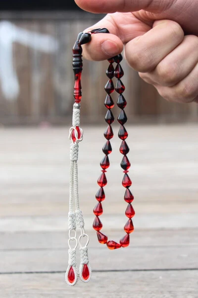 Drop cut red and black fire amber rosary - 1