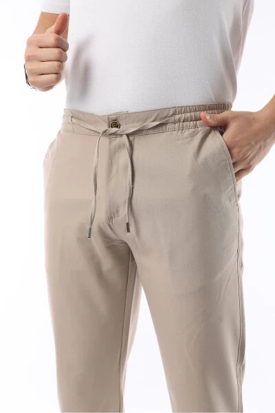 Erkaklar uchun bej rangli Jogger kesimli, elastik belbog'li, moslashuvchan likrali va Slim Fit matoli shim - İDS COLLECTİON (1)