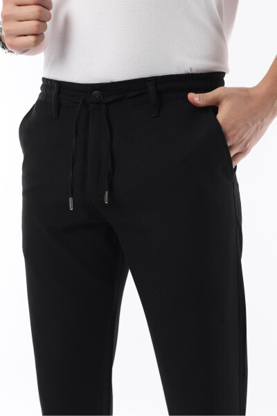 Erkaklar uchun qora rangli, bel qismi elastikli, cho'ziluvchan likradan tikilgan slimfit mato pantolon - İDS COLLECTİON (1)