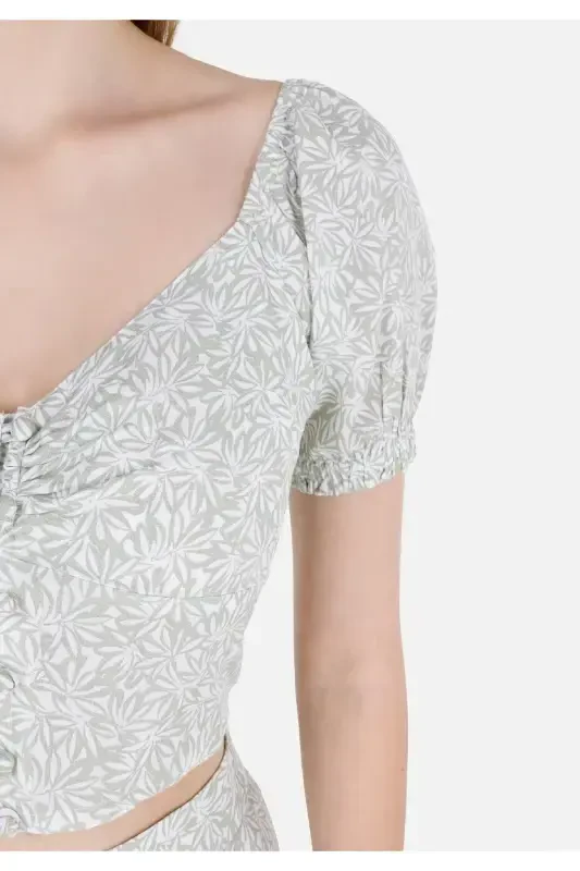 Green, short-sleeved, V-neck, slim fit, patterned women's shirt. - 5