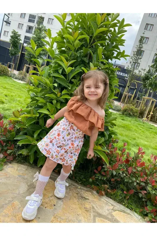 Gulli naqshli tugmali yubka-krem - BEBEĞİME ÇORAP