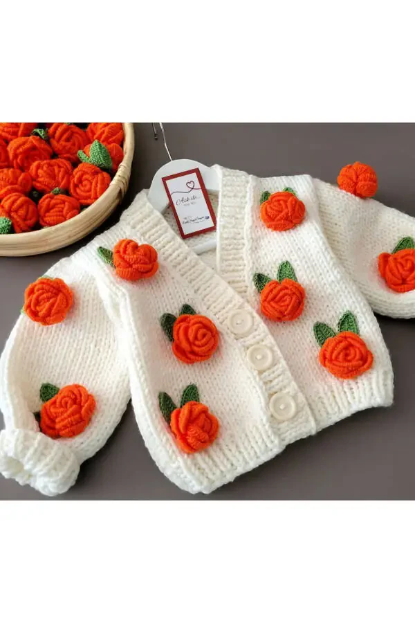 Hand knitted baby cardigan with flower details - 1