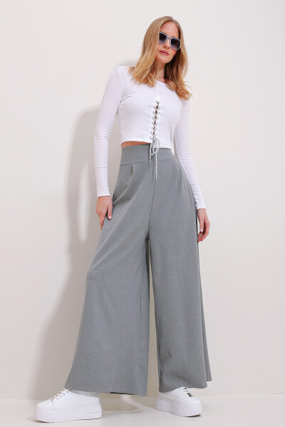 High-waisted, zippered, wide-leg woven pants. - 1