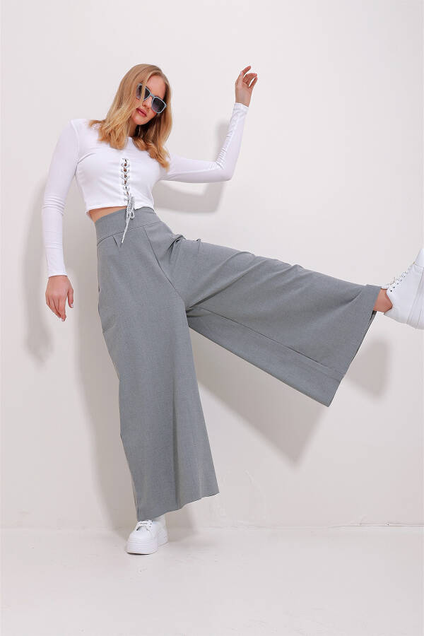 High-waisted, zippered, wide-leg woven pants. - 2