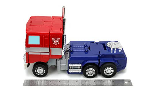 Jada Toys - Transformers Optimus Prime Konvertatsiya qiluvchi RC Avtomobil - Bolalar o'yinchoq sovg'asi - Yuk mashinasidan robotga o'zgarish - Chiroqlar va tovushlar - To'liq funksiyali masofadan boshqarish pulti - 13' Uzun - 6