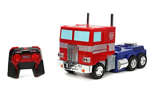 Jada Toys - Transformers Optimus Prime Konvertatsiya qiluvchi RC Avtomobil - Bolalar o'yinchoq sovg'asi - Yuk mashinasidan robotga o'zgarish - Chiroqlar va tovushlar - To'liq funksiyali masofadan boshqarish pulti - 13' Uzun - 13