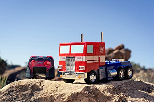 Jada Toys - Transformers Optimus Prime Преобразующийся RC автомобиль - Подарок для детей с трансформацией из грузовика в робота - Световые и звуковые эффекты - Полностью функциональный пульт дистанционного управления - 13' в длину - 4