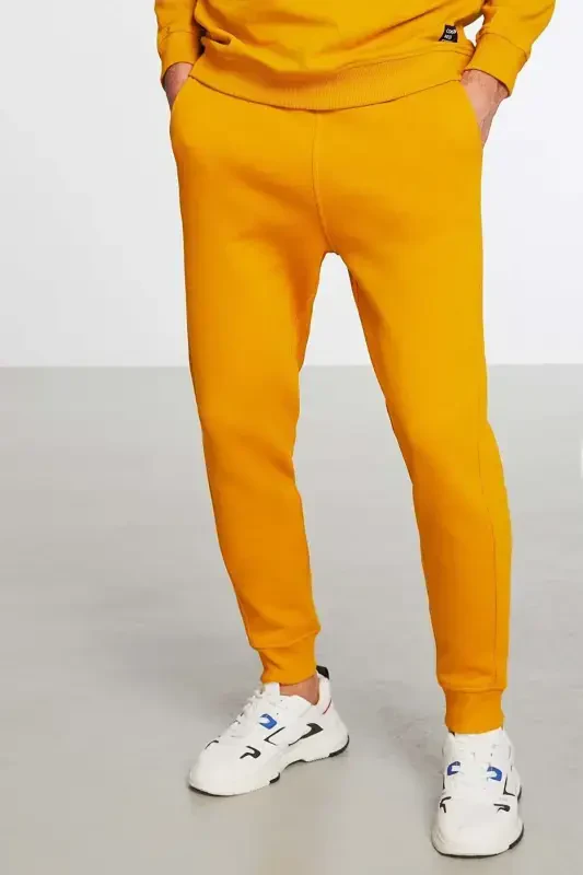 Jeremiah Men's Regular Leg Flexible Fabric Drawstring Waistband and Elasticated Pocketed Saffron Yellow Sweatpants-Saffron Yellow - 1