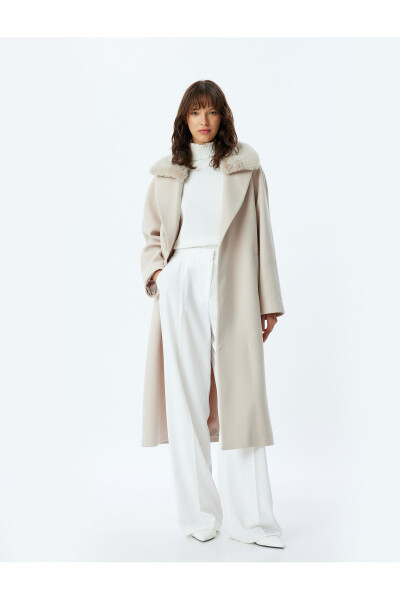 Long cashmere coat with faux fur collar, pockets and belt. - 11