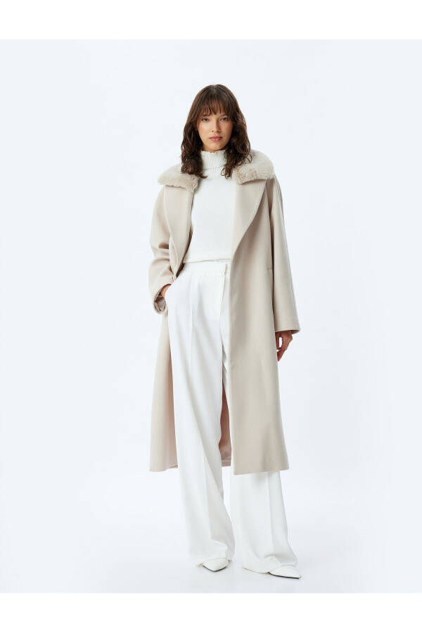 Long cashmere coat with faux fur collar, pockets and belt. - 11