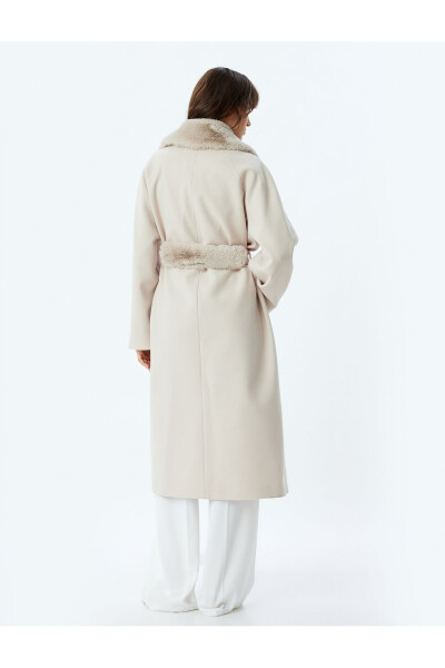 Long cashmere coat with faux fur collar, pockets and belt. - 14